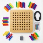 MoniBabu Light Up Peg Board flat lay with 64 acrylic pegs remote and USB cable MoniBabu light up peg board with 64 acrylic pegs, remote, USB cable and wall adapter