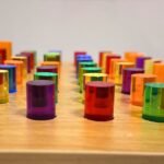 Close-up of colorful acrylic pegs on the light up peg board Close-up of colorful acrylic pegs on the wooden light up peg board